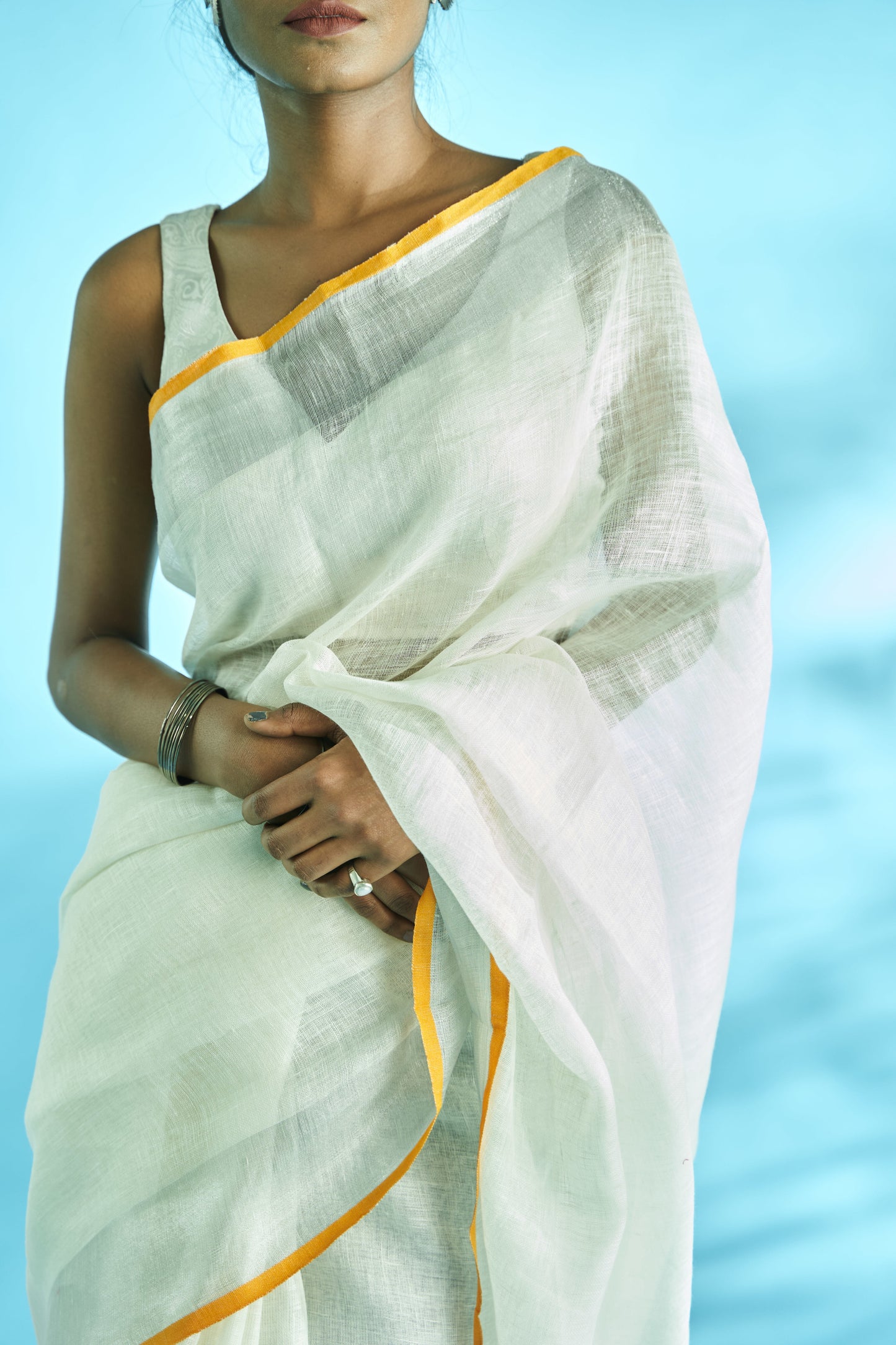 Smart and Elegant Plain Linen Banarasi Saree with rupa zari border and aanchal. Best clothing for summer