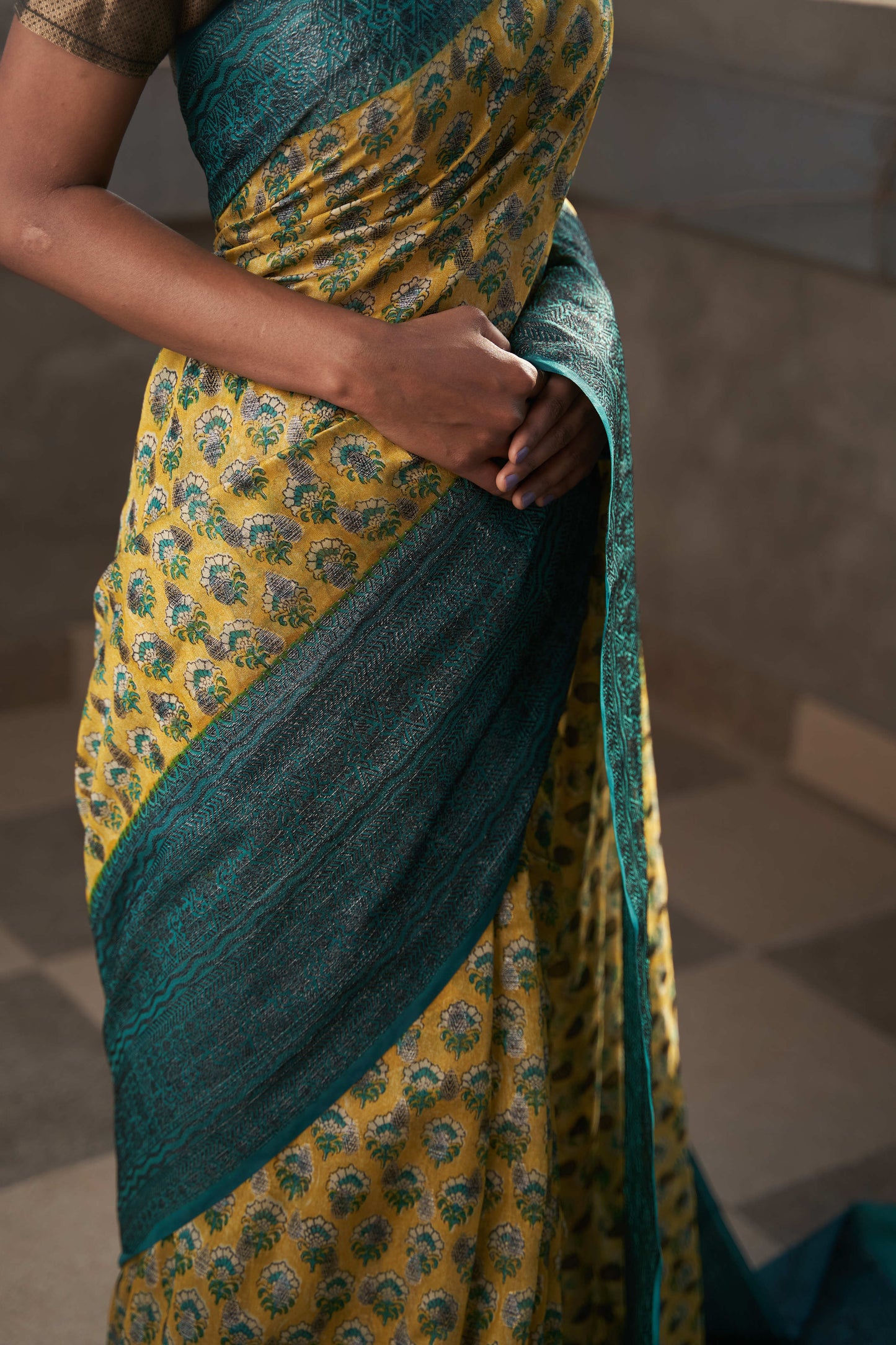 riya silk saree with block print and black zari all over, with contrast order